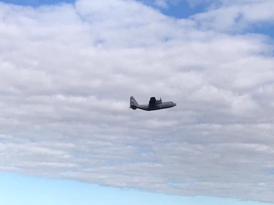 C-130 cargo aircraft in flight over Puerto Rico